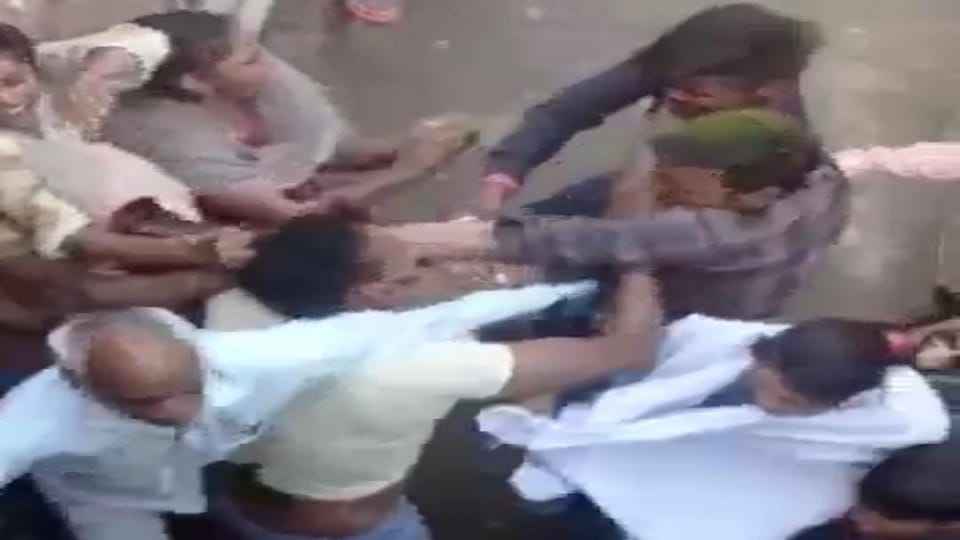 For refusing to drink liquor near house with sticks four injured including a woman