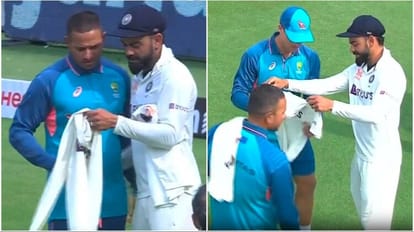 कोहली ख्वाजा और कैरी को जर्सी देते हुए