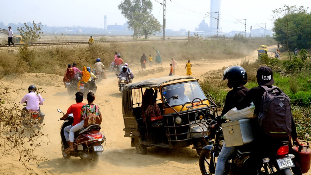 large population forced to travel through potholed road near Mahesara bridge