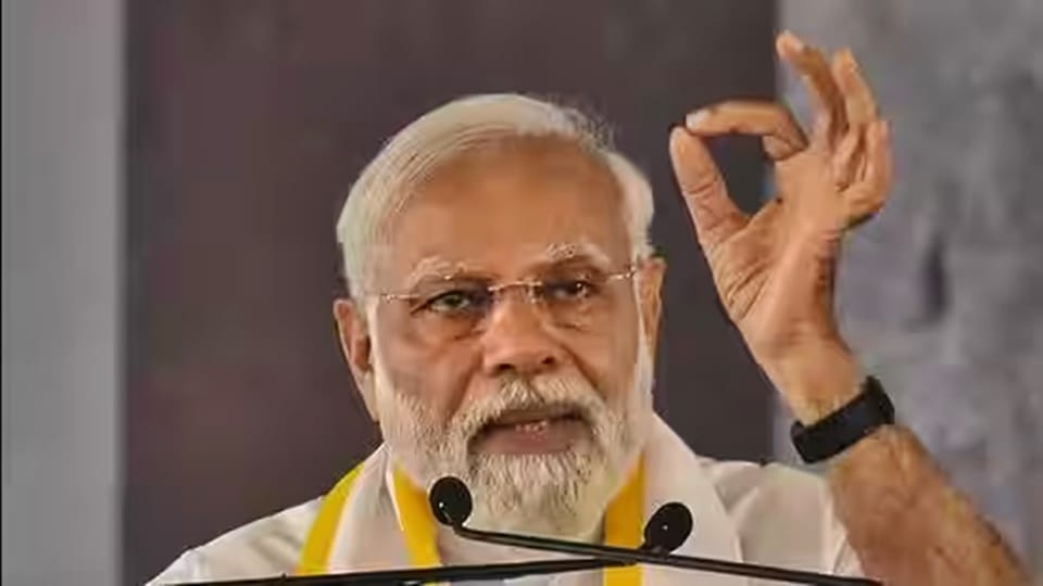 Congress MLA fined Rs 99 for tearing PM Modi photo