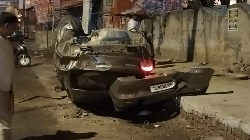 Baleno overturns after hitting divider one killed driver injured in delhi