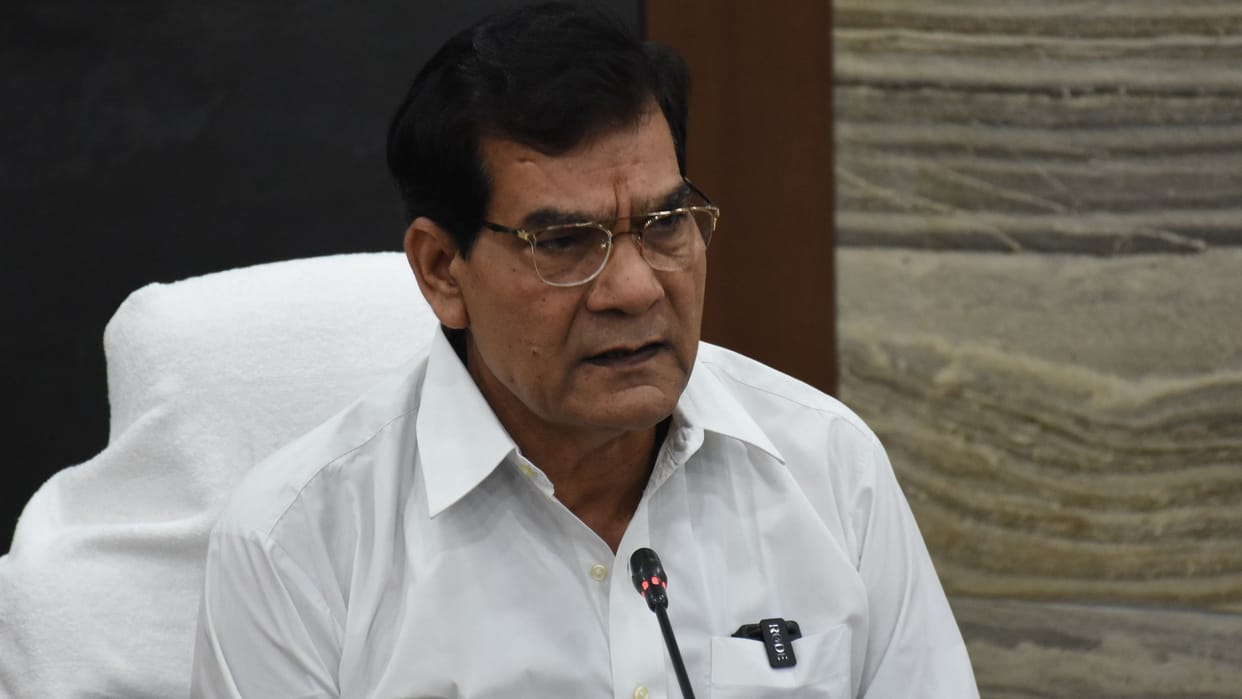 UP Minister A K Sharma instructs officers over problems people are facing during rain.