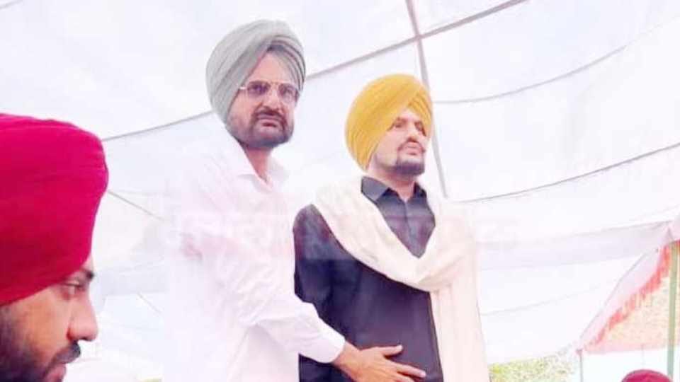 video of Sidhu Moosewala father and newborn brother pictures being shown at Times Square New York