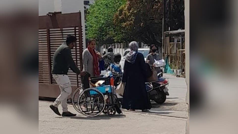 Doon Hospital: Patients Relatives pulling stretcher in emergency