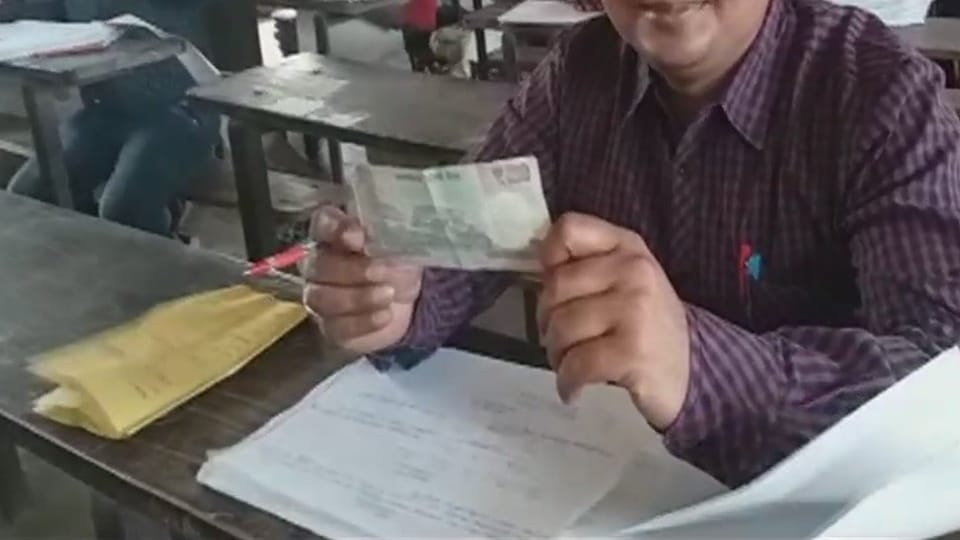 up board exam copy checking money found in copy