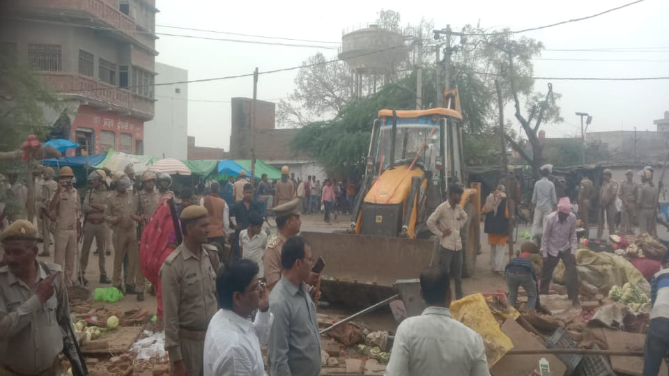 shops built on pond land were demolished by administration by running bulldozer In Firozabad