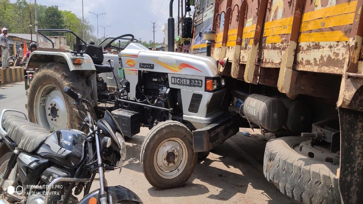 Due to the carelessness of the car driver the tractor rammed into the truck