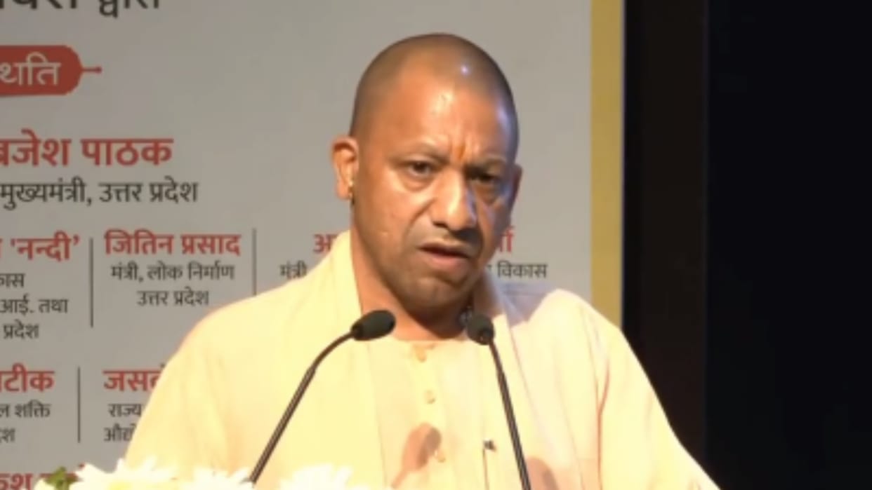 CM Yogi Adityanath distributes the joining letter to new officers.