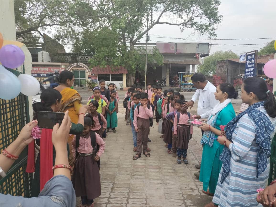 Somewhere children were welcomed by giving sandalwood vaccine and somewhere flowers, children were happy