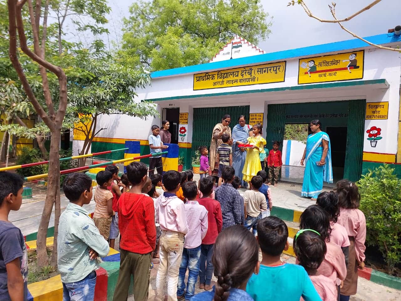 Somewhere children were welcomed by giving sandalwood vaccine and somewhere flowers, children were happy