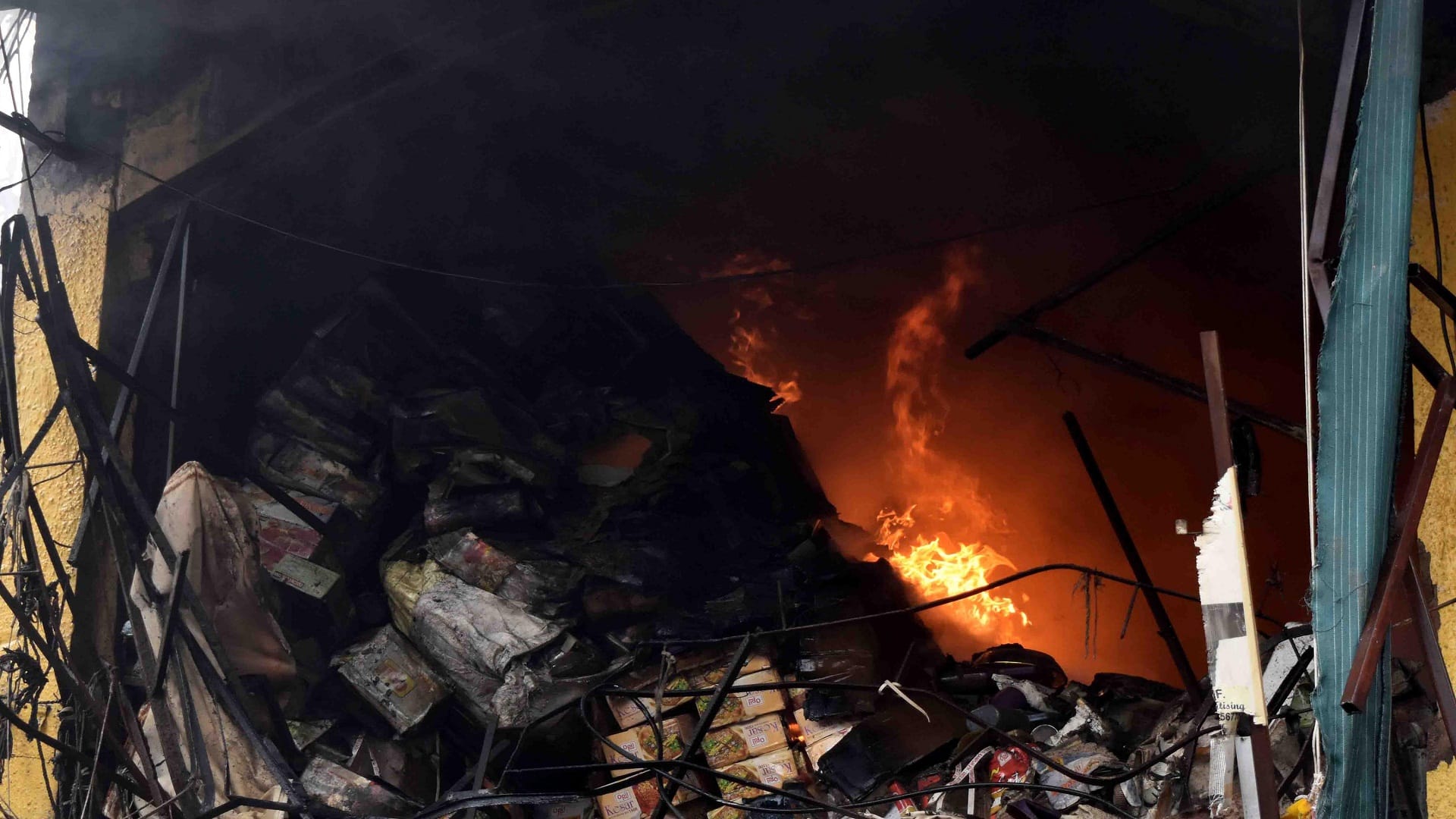 The shopkeepers kept watching the desires turn to ashes with moist eyes, the fire extinguished after five hour