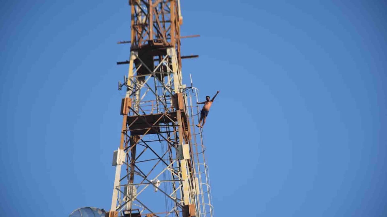 sudpended dak sewak climb on tower