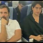 फ्लाइट में बहन प्रियंका गांधी के साथ राहुल।