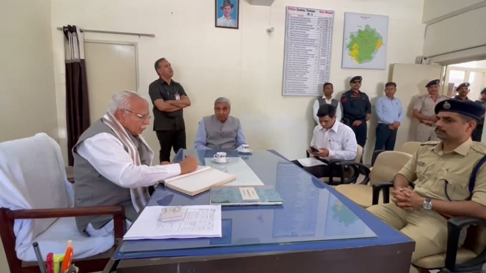 CM Manohar unique style: sitting on chair of Tosham police station SHO, checked register