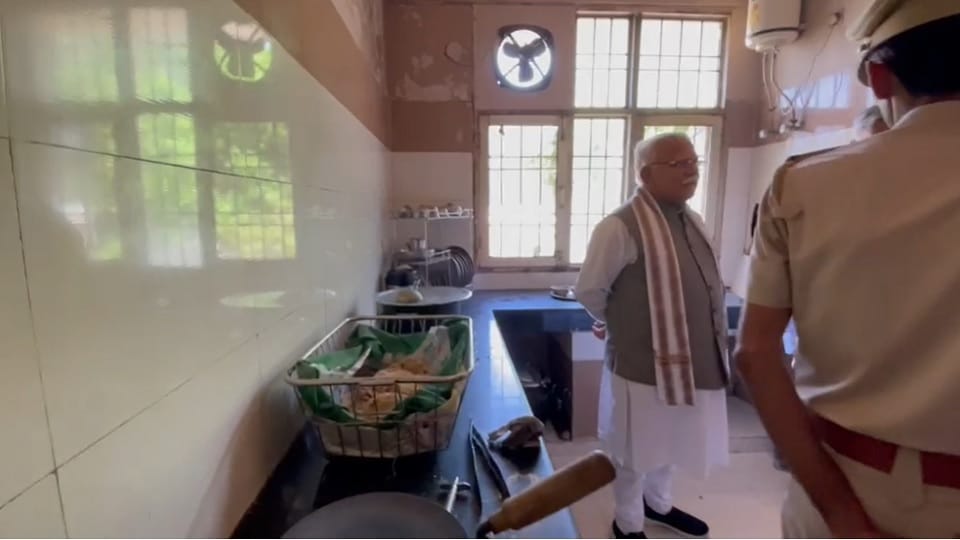 CM Manohar unique style: sitting on chair of Tosham police station SHO, checked register