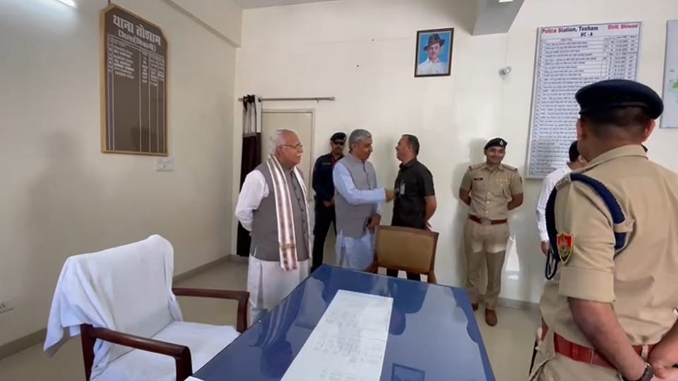 CM Manohar unique style: sitting on chair of Tosham police station SHO, checked register