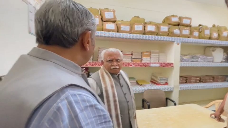 CM Manohar unique style: sitting on chair of Tosham police station SHO, checked register