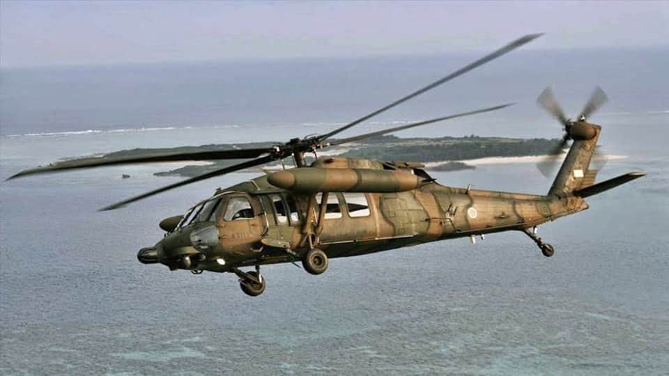 Japan coast guard says searching for a missing military helicopter carrying 10 crew members