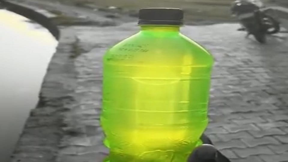 Minaret like shape of a mosque seen in a cold drink bottle
