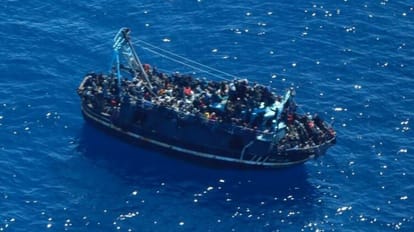 Boat with around 400 people on board is adrift between Greece and Malta and is taking on water