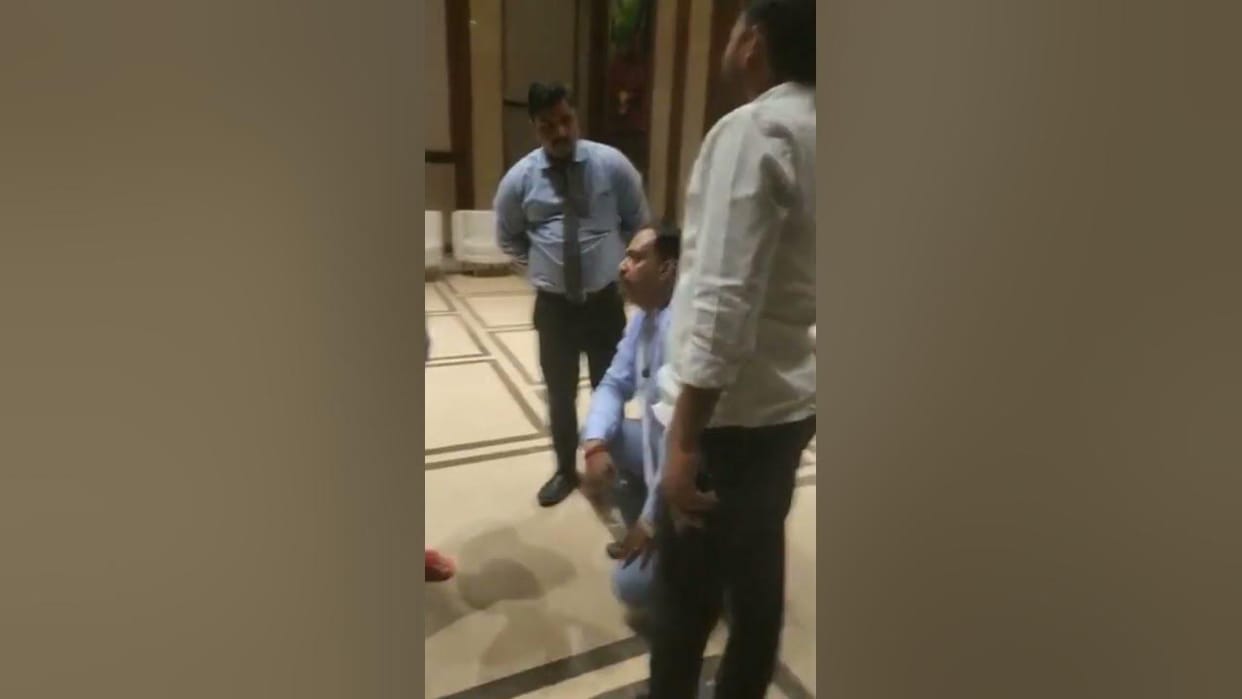 Varanasi: Hotel management kneels down, manager sitting in front of Tej Pratap, video viral