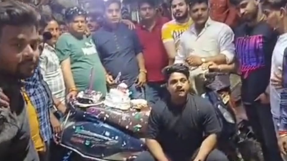 BJP leader cuts cake with sword, waves pistol in air