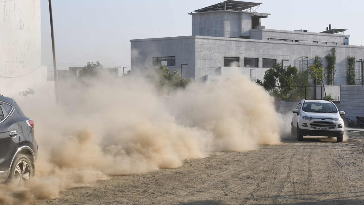 Heavy pollution cloud of dust in front of boating and circuit house