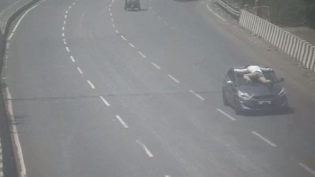 22 year old man takes traffic cop for 12km ride on his car bonnet