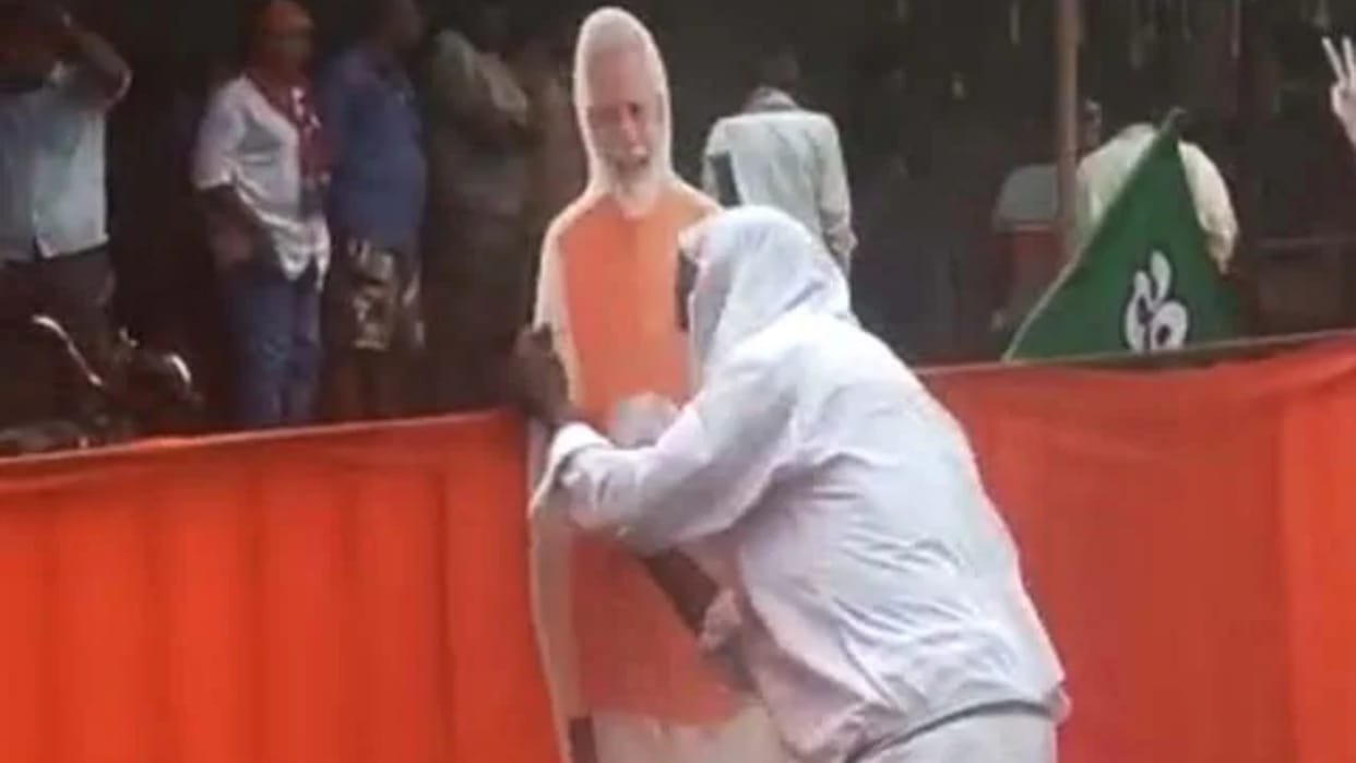 Karnataka Election: man seen cleaning rain water from PM's cutout, Home Minister praised; watch video