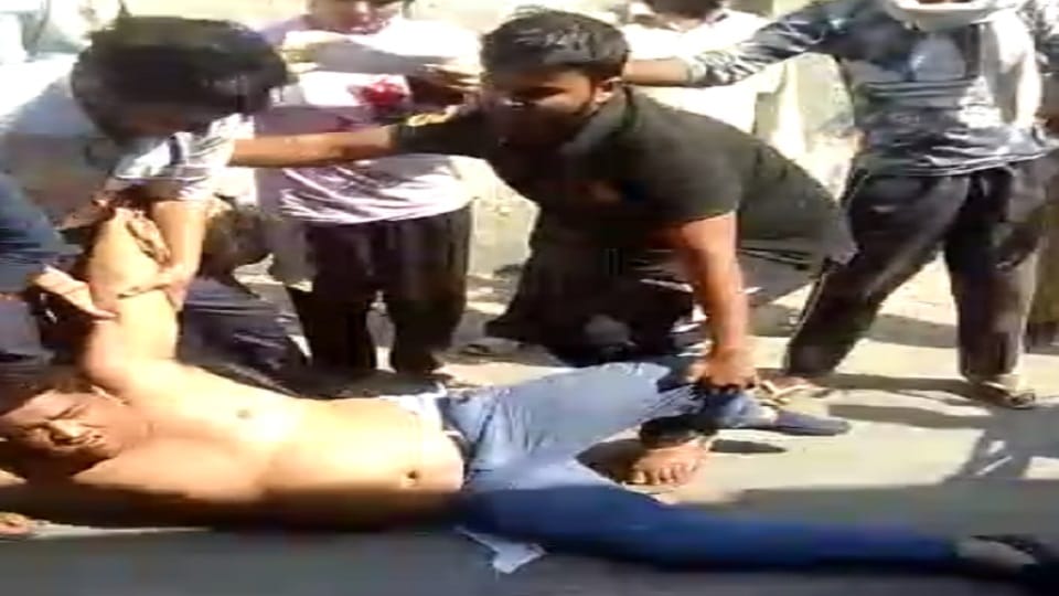 Filled market youth beaten up Police remained mute spectators