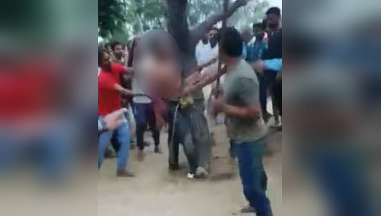 young man was mercilessly beaten by tying him to a tree, the video went viral