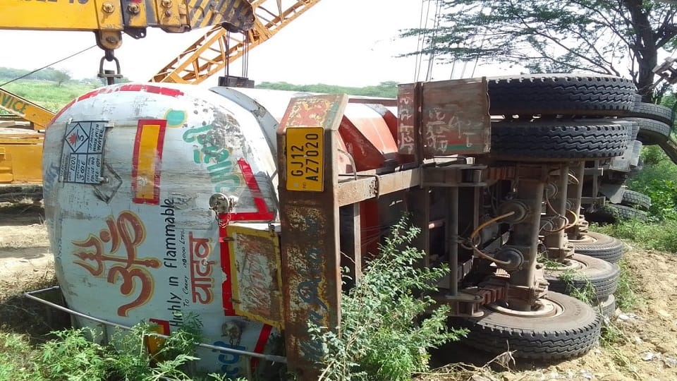 Tanker full of flammable chemical overturned