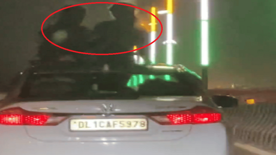 viral video two girls performing dangerous stunts from sunroof car noida