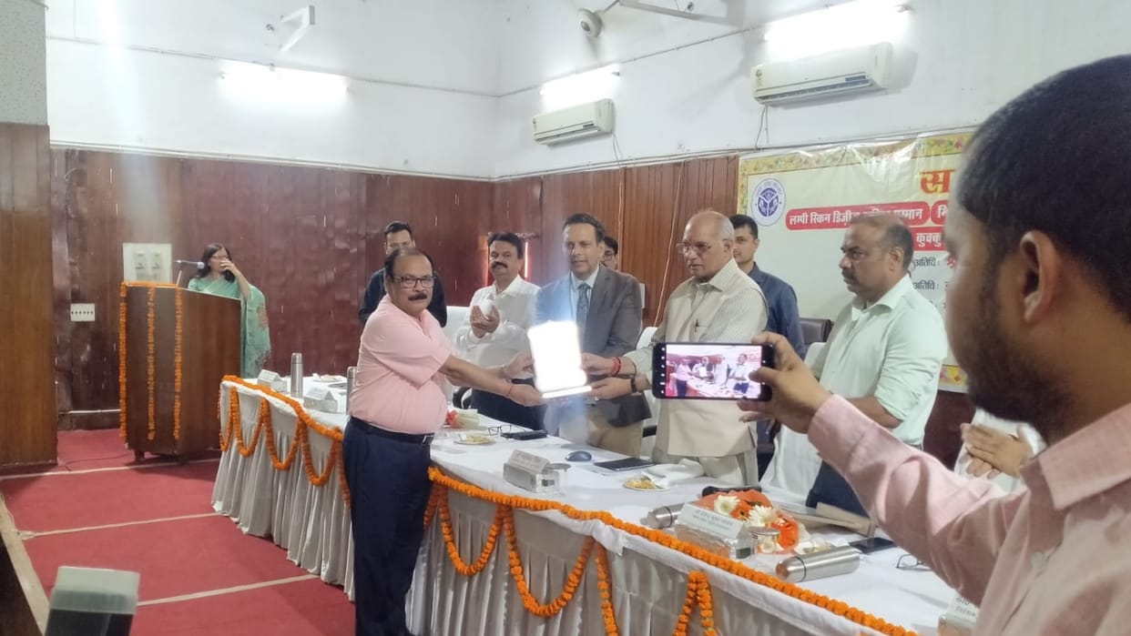 UP animal husbandry minister honours officers in Lucknow.