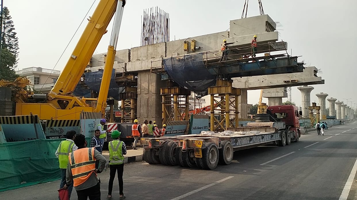 Rapid Rail Track Cunstruction: Pillar foundation placed with crane, highway jammed for one hour