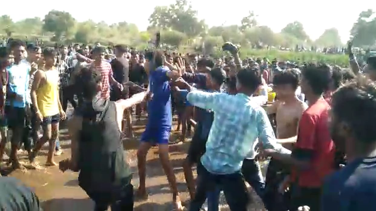 video two groups fiercely fighting with sticks and belts at picnic spot in korba