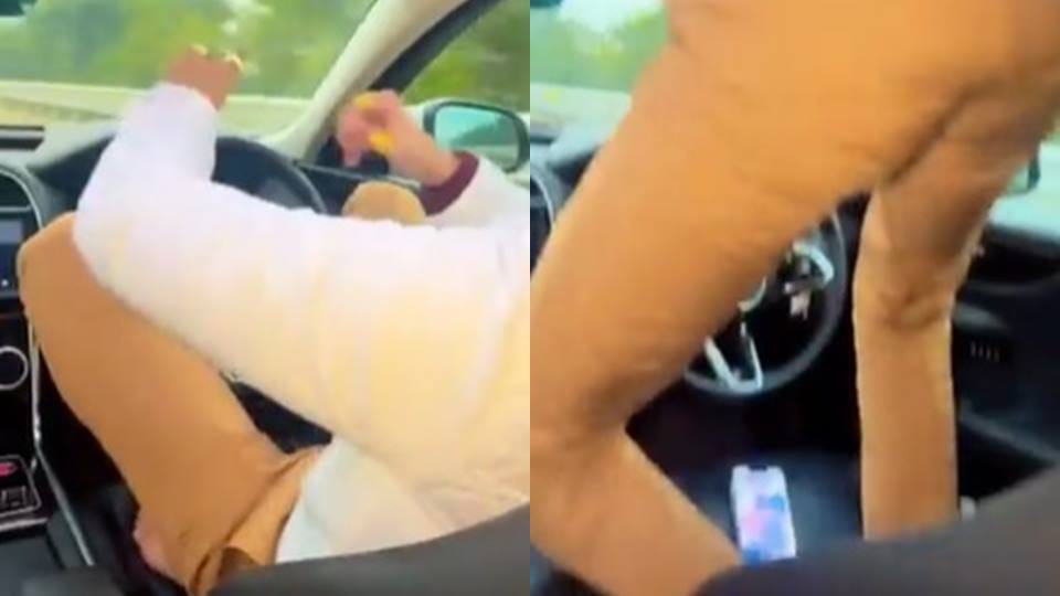 Leaving the steering of the moving car, the driver got out of the sunroof