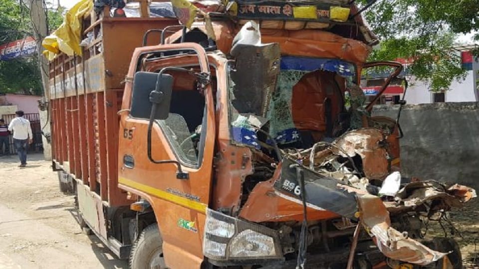 Canter rammed into standing truck two traders died