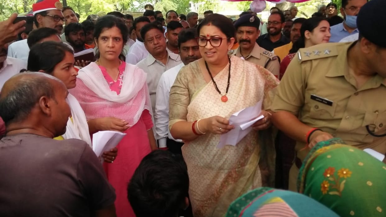 Cabinet minister Smriti Irani listens the problem of people of Raebareli.