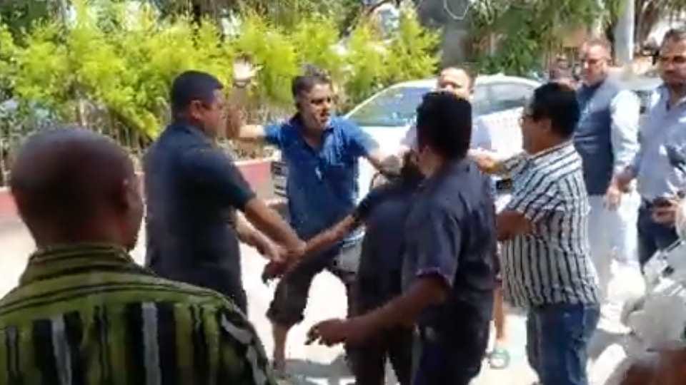 Dehradun News Youth Beaten in front of cabinet minister Ganesh joshi in Dakra market video going viral