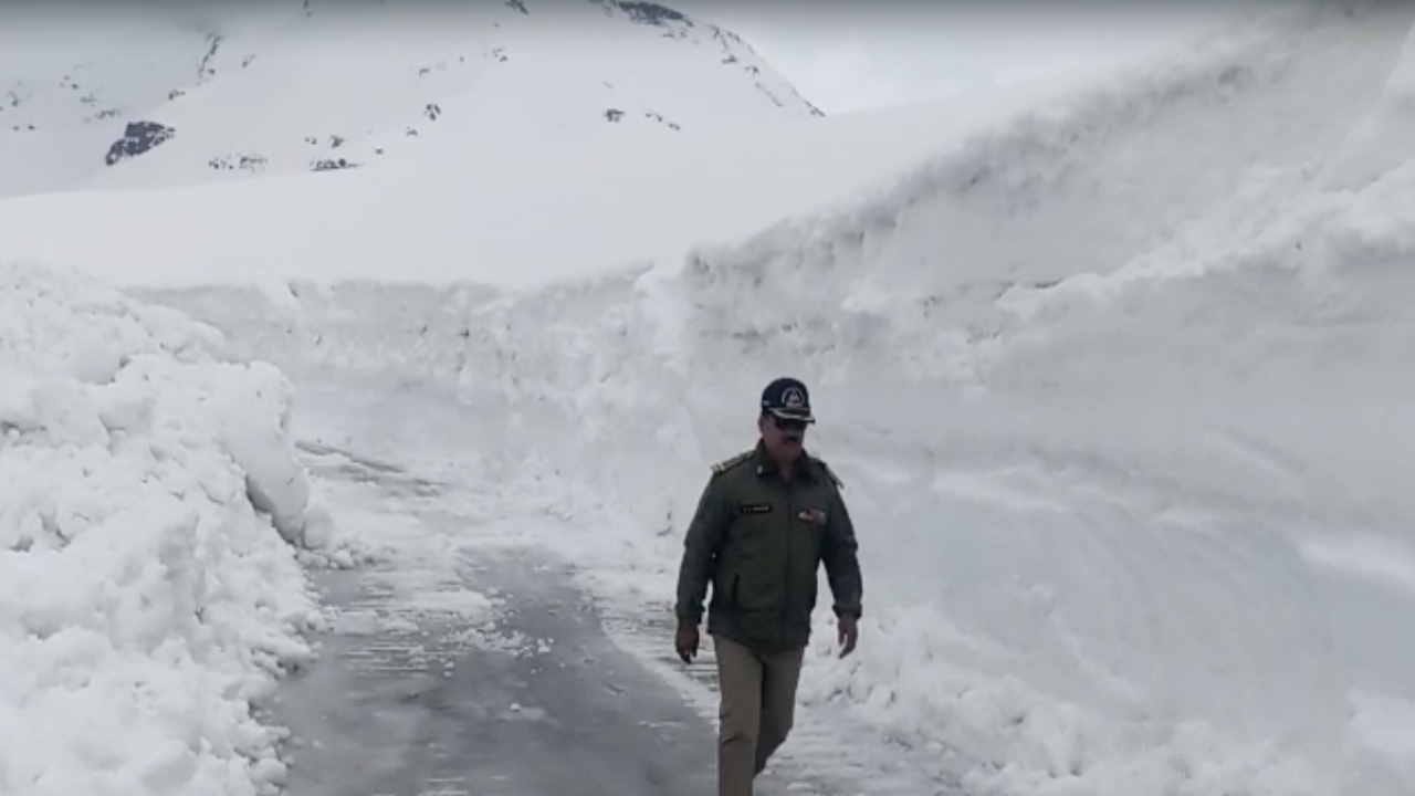 Rohtang Pass being restored by cutting 12 feet high walls of ice in minus temperature, see photos