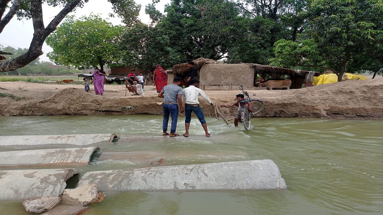 The bridge was washed away in the strong current of water