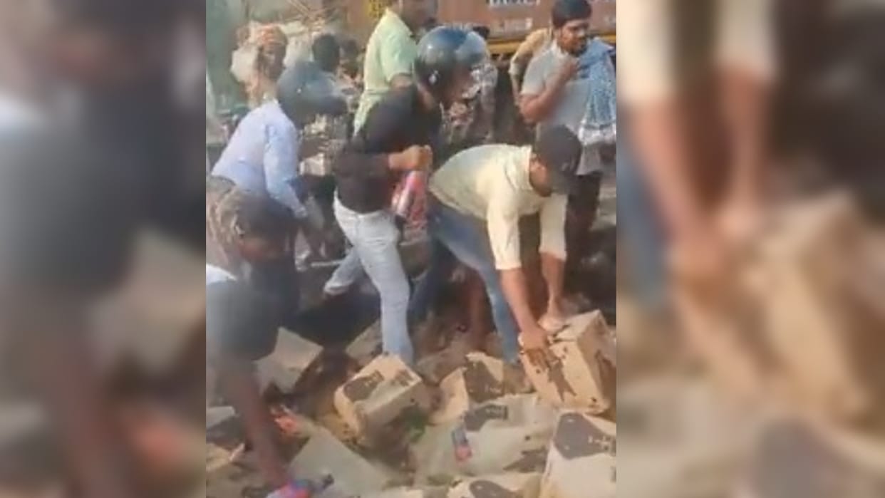 viral video people steal beer bottles after truck overturns on road with beer boxes in andhra pradesh