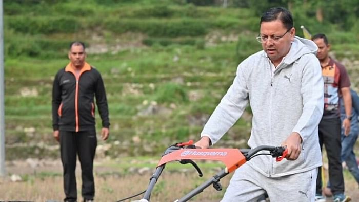 CM Dhami two-day Uttarkashi tour went on morning walk sowed Mandua plowed the fields with power weeder