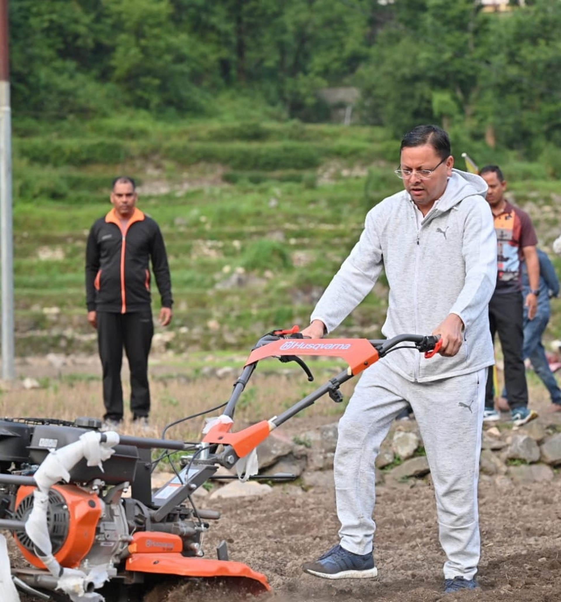 CM Dhami two-day Uttarkashi tour went on morning walk sowed Mandua plowed the fields with power weeder
