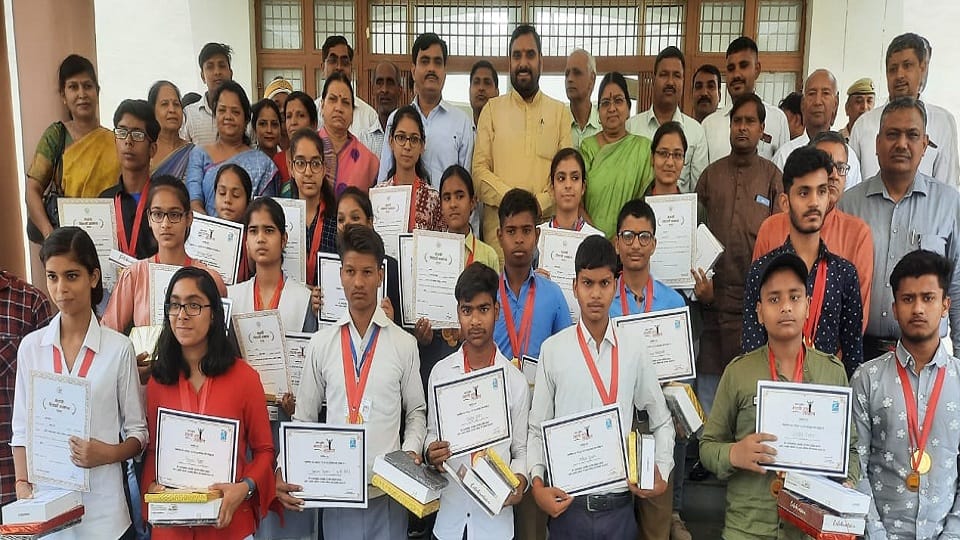 faces of meritorious students blossomed after receiving tablets and citations