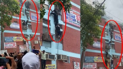 Delhi Mukherjee Nagar Fire Accident in Coaching Center Student Seen Climbing Out of Building News in Hindi