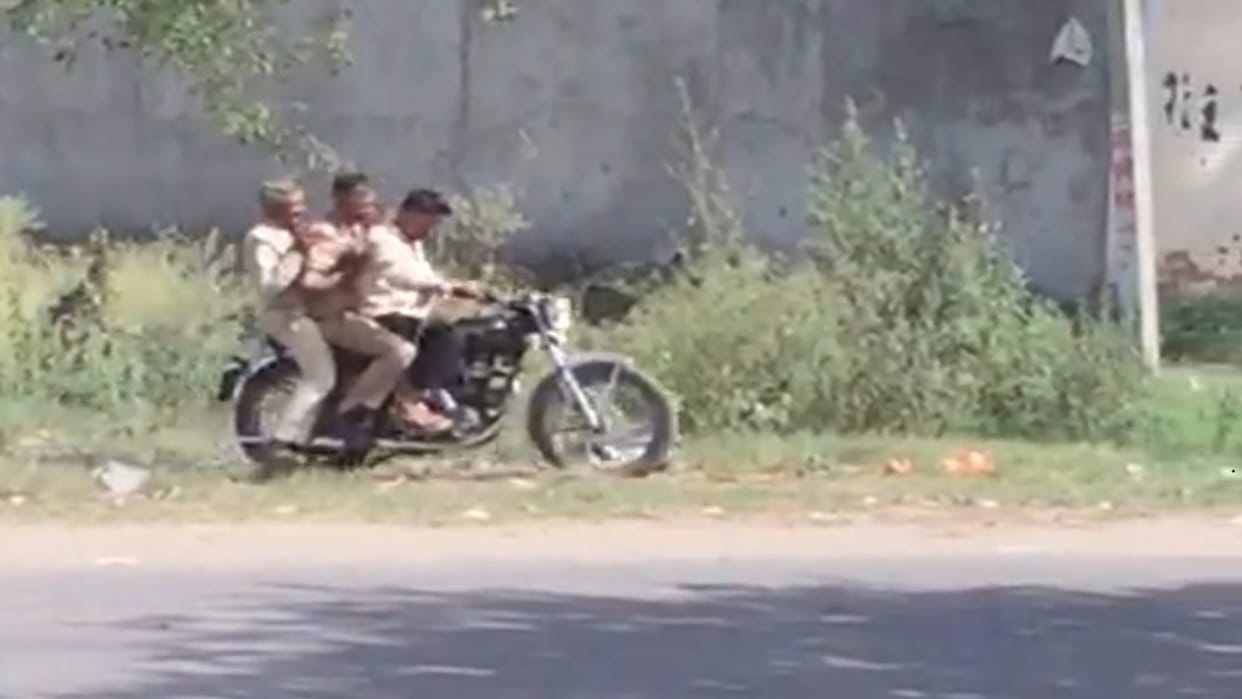Viral video of handcuffed accused riding bike