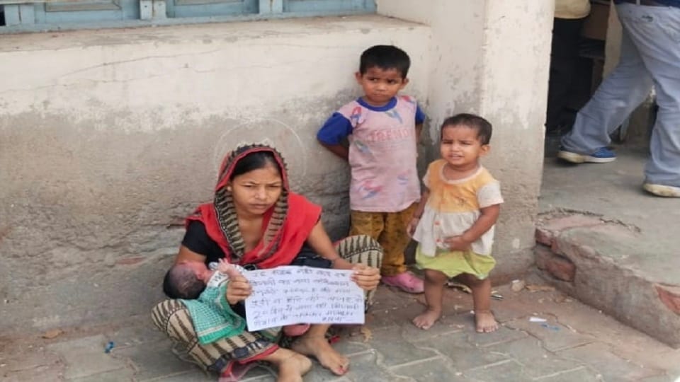 Woman sitting on dharna with three children in scorching heat demand is very small