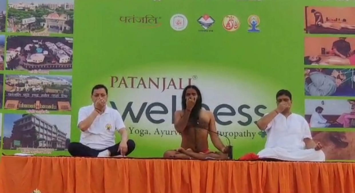 International Yoga Day 2023 Uttarakhand CM Dhami Baba Ramdev Watch Photos